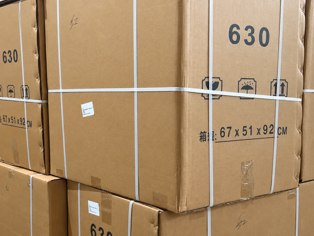Strapped emergency trolley cartons with labels and handling symbols